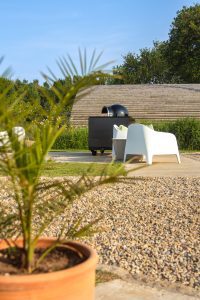 Communal area with wood-fired pizza oven at The Hygge Out glamping site