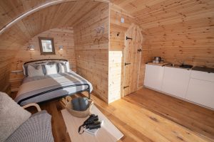 Shelter Pod sofa bed and kitchenette interior, North Yorkshire glamping pod