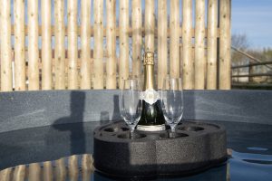 Shelter Pod floating drinks holder in wood-burning hot tub, North Yorkshire glamping